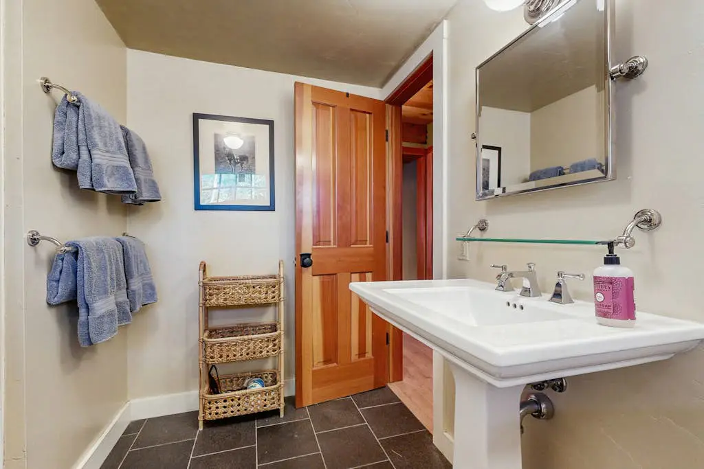 Luxury lakefront home with private hot tub, on-site dock, fireplace & HOA beach