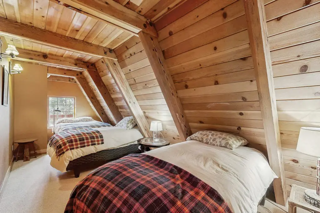 Luxury lakefront home with private hot tub, on-site dock, fireplace & HOA beach