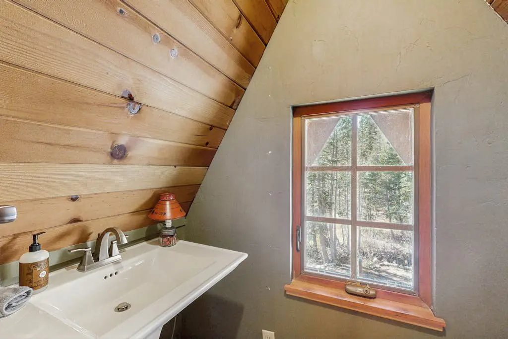 Luxury lakefront home with private hot tub, on-site dock, fireplace & HOA beach
