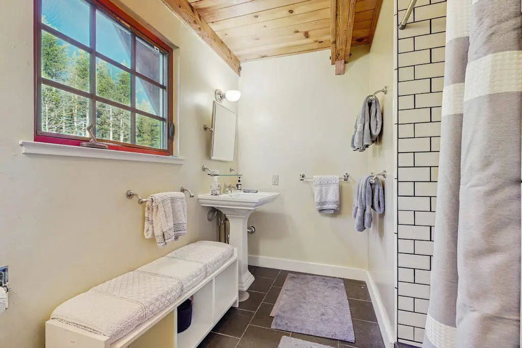 Luxury lakefront home with private hot tub, on-site dock, fireplace & HOA beach
