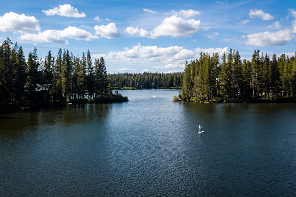 Luxury lakefront home with private hot tub, on-site dock, fireplace & HOA beach