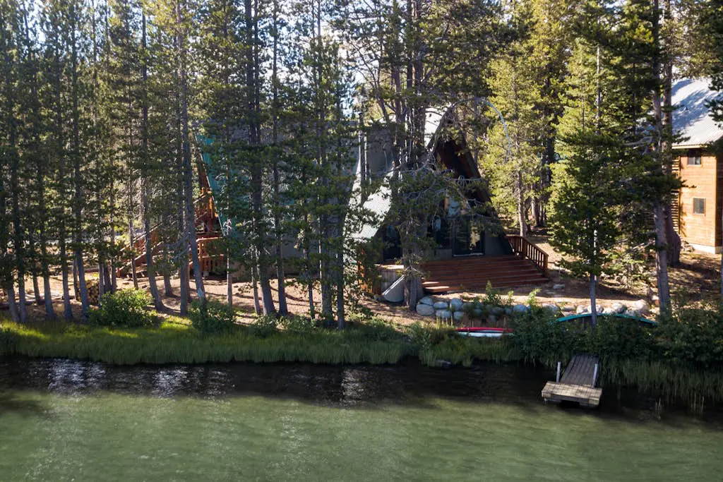 Luxury lakefront home with private hot tub, on-site dock, fireplace & HOA beach