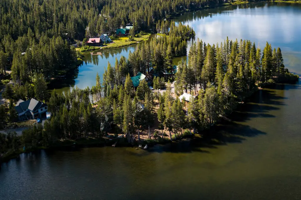 Luxury lakefront home with private hot tub, on-site dock, fireplace & HOA beach