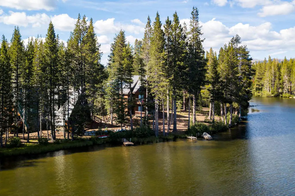 Luxury lakefront home with private hot tub, on-site dock, fireplace & HOA beach