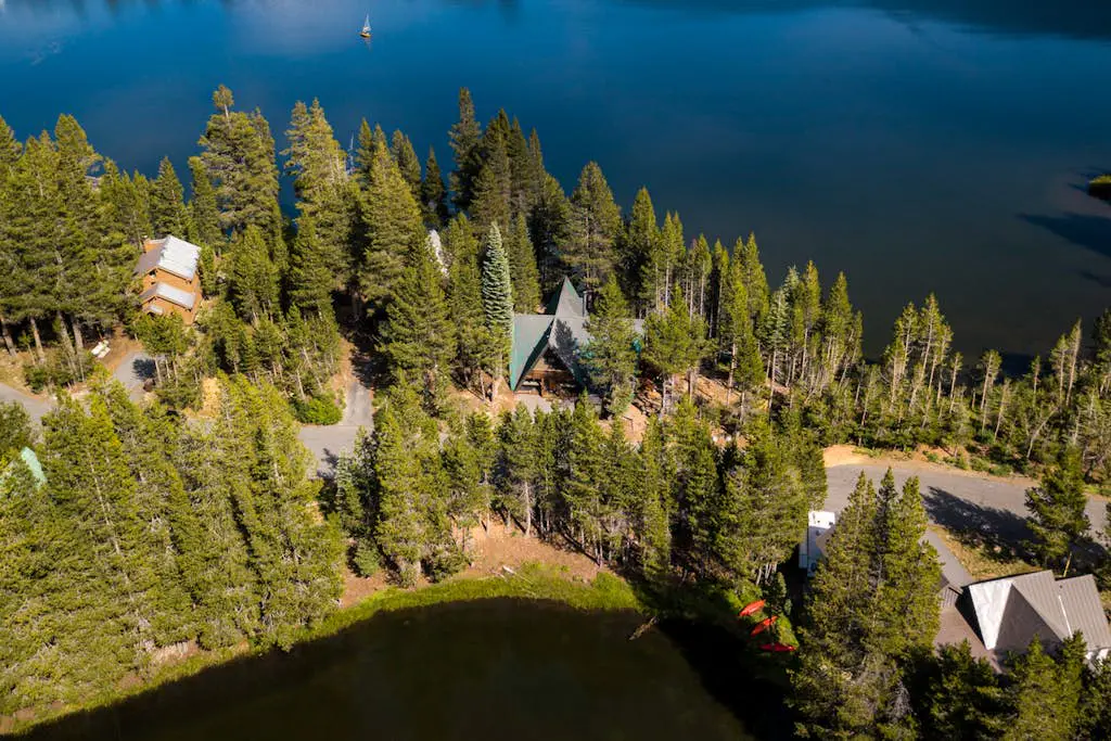 Luxury lakefront home with private hot tub, on-site dock, fireplace & HOA beach
