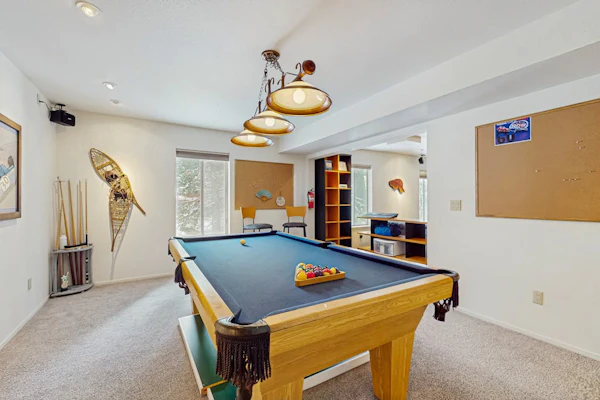 Family-friendly home with mountain views, pool table, fireplace, & spacious deck