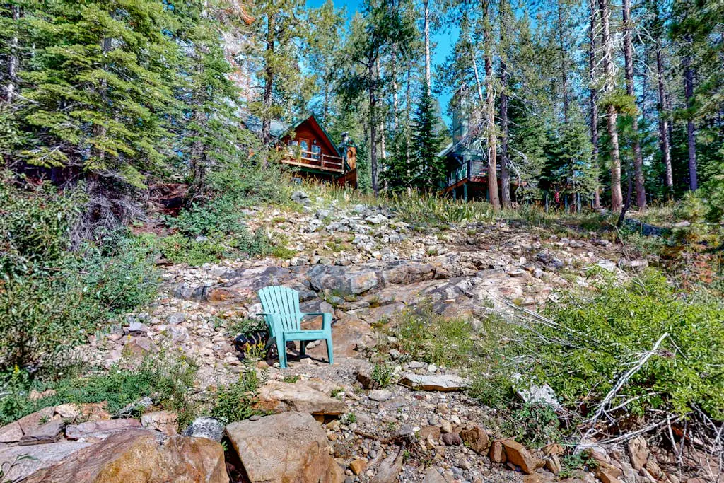 Riverfront dog-friendly retreat with a rustic flair & wood stove, near skiing