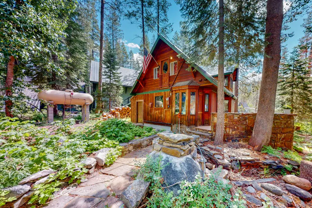 Riverfront dog-friendly retreat with a rustic flair & wood stove, near skiing
