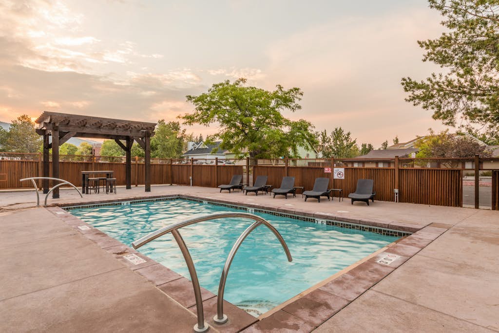 Central condo with WiFi, AC, patio, hot tub, & seasonal pool