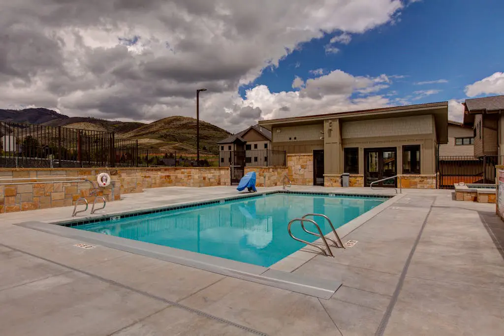 Luxury condo with large deck, pool/hot tub, walk to ski access