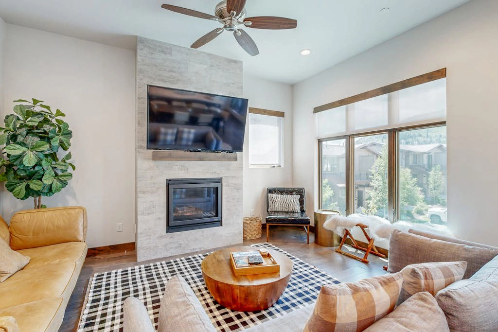 Professionally designed mountain-view condo with a pool, grill, & fireplace