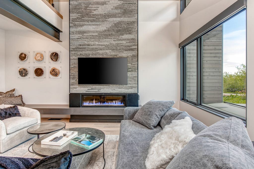 Updated home with a private hot tub, fireplace, & mountain views - dog friendly