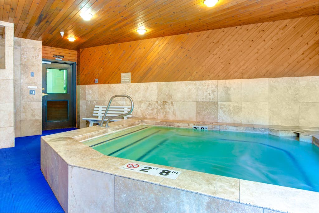 Top-floor, mountain view condo with fireplace, pool & hot tub - steps to shuttle