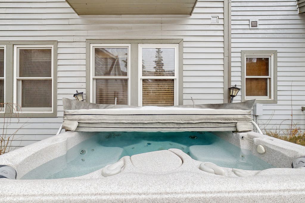 Mountain view home with hot tub, fireplace & perfect walk-to-lift location