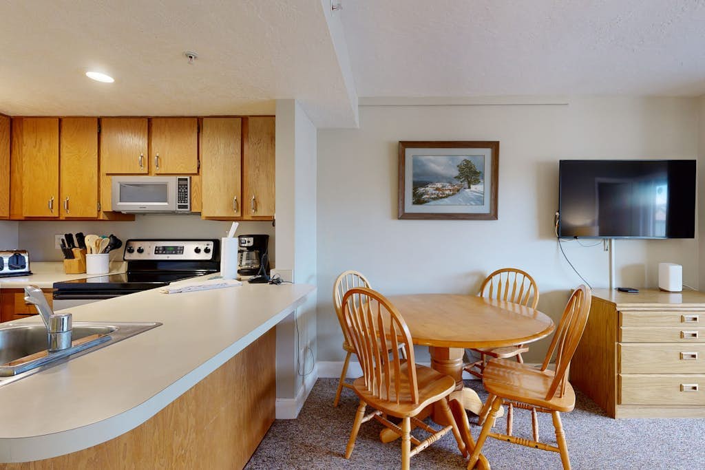 Mountain-view condo with fireplace, near skiing & main street, on shuttle route