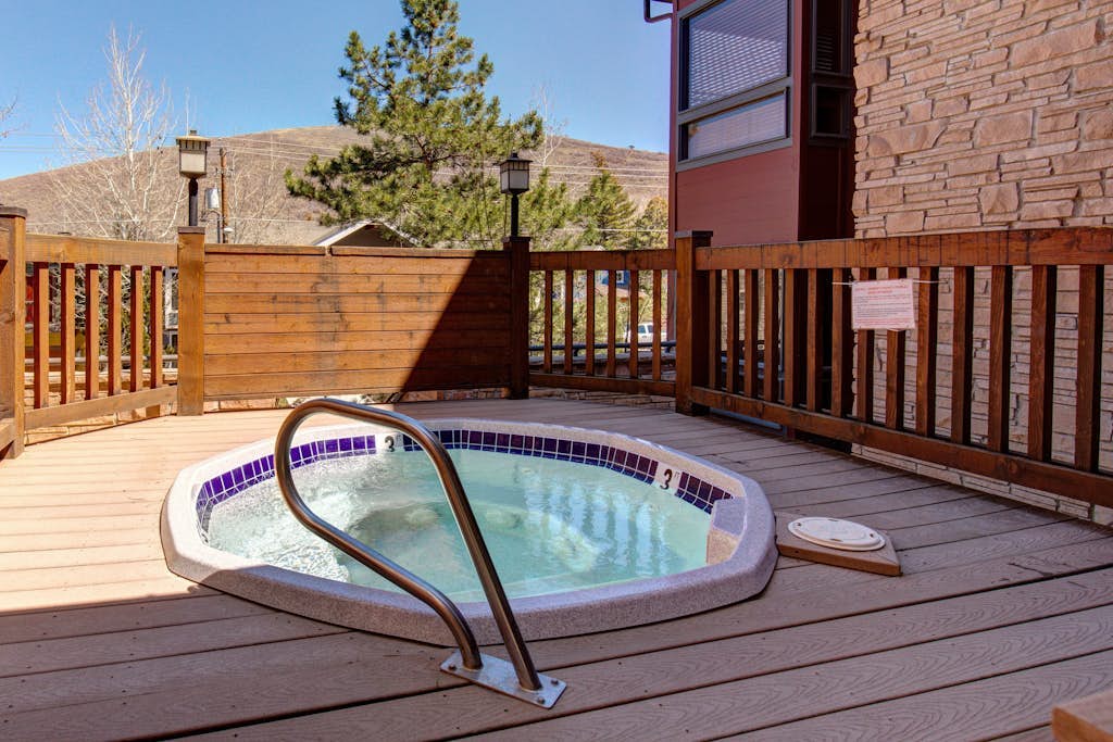 Walk to lifts & Main St condo with hot tub, heated garage, & mountain view