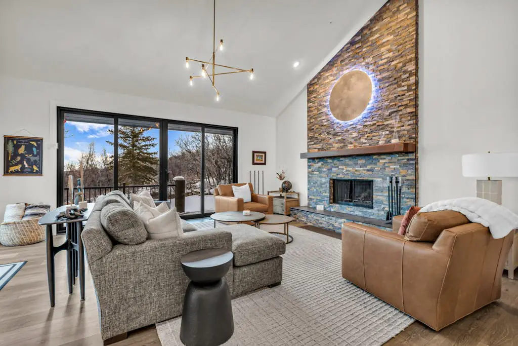 Mountain-view abode with a hot tub, scenic balcony, fireplaces, & free shuttle