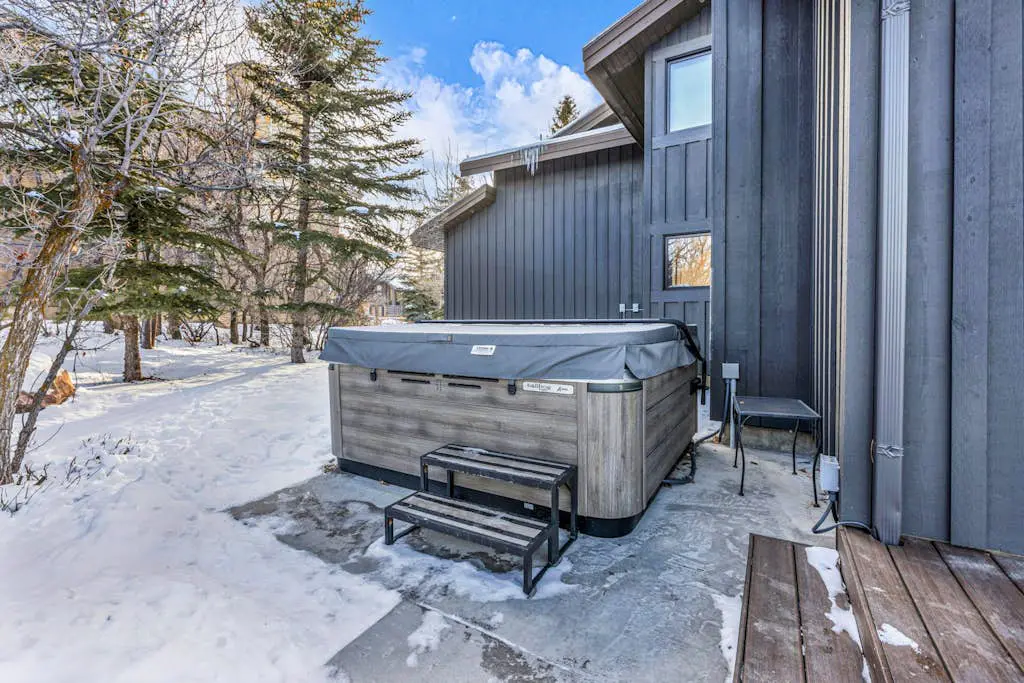 Mountain-view abode with a hot tub, scenic balcony, fireplaces, & free shuttle