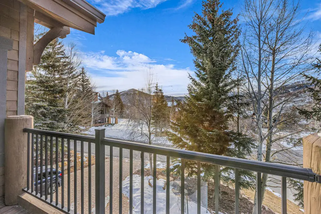 Mountain-view abode with a hot tub, scenic balcony, fireplaces, & free shuttle