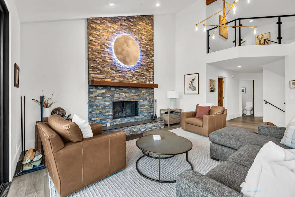 Mountain-view abode with a hot tub, scenic balcony, fireplaces, & free shuttle