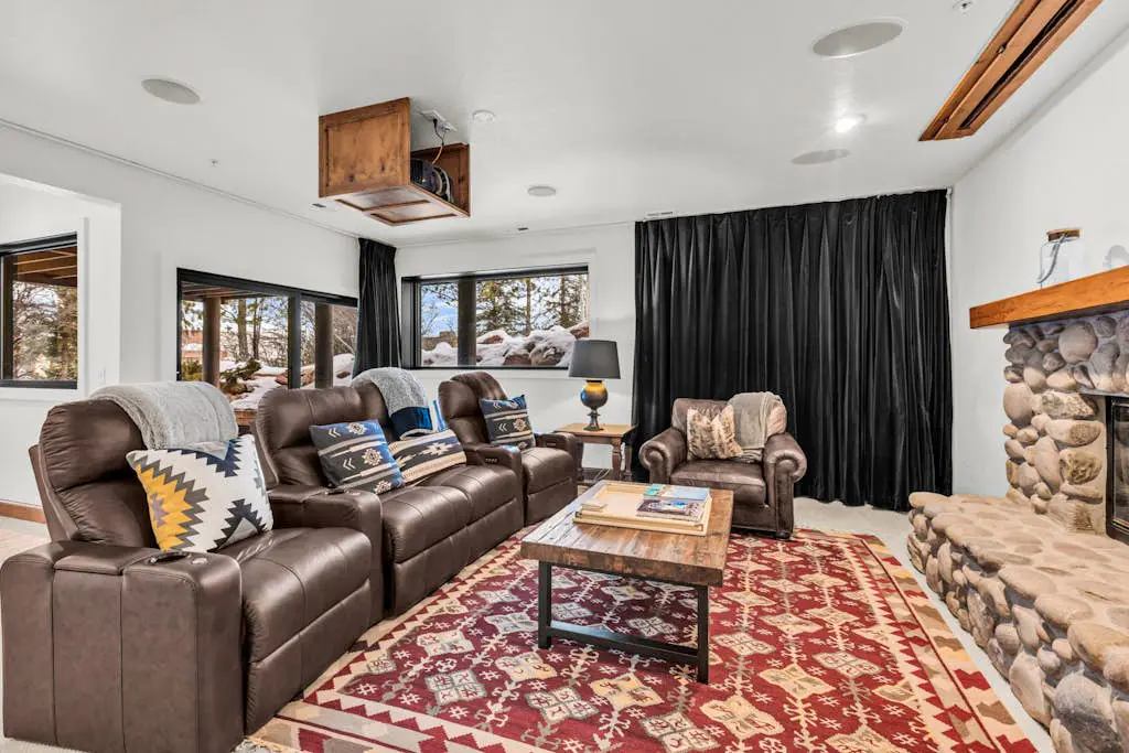 Mountain-view abode with a hot tub, scenic balcony, fireplaces, & free shuttle