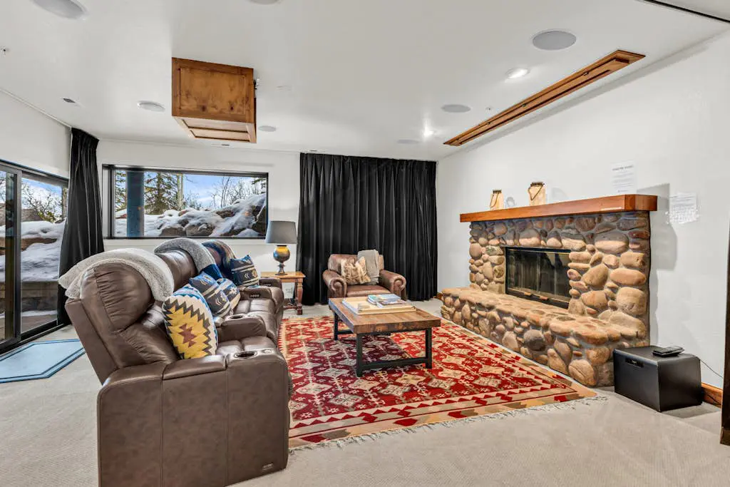 Mountain-view abode with a hot tub, scenic balcony, fireplaces, & free shuttle