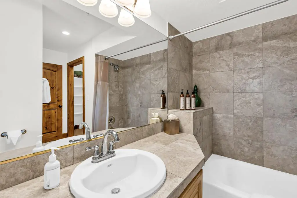 Mountain-view abode with a hot tub, scenic balcony, fireplaces, & free shuttle