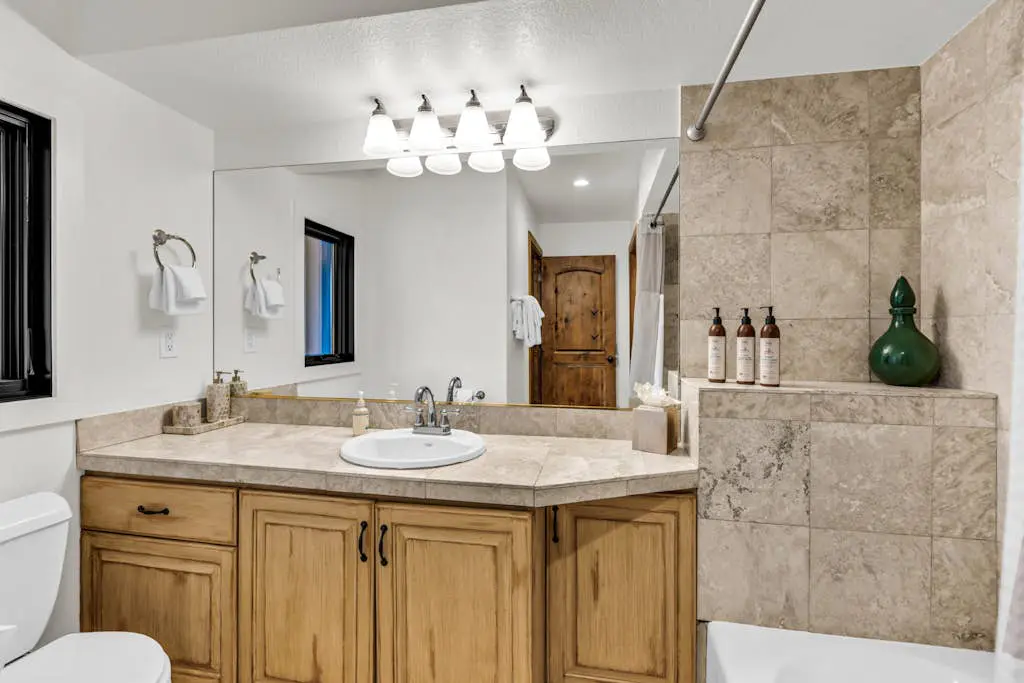 Mountain-view abode with a hot tub, scenic balcony, fireplaces, & free shuttle