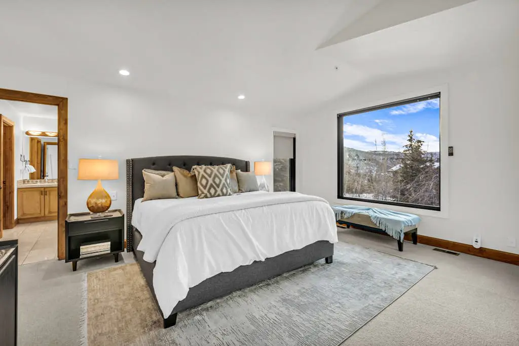 Mountain-view abode with a hot tub, scenic balcony, fireplaces, & free shuttle