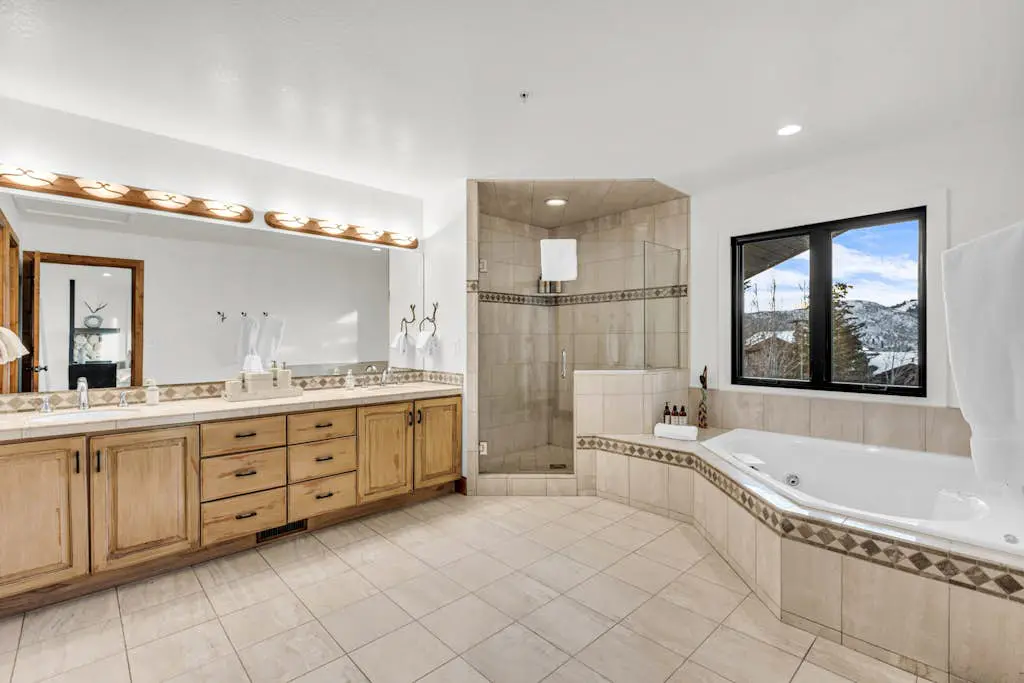 Mountain-view abode with a hot tub, scenic balcony, fireplaces, & free shuttle