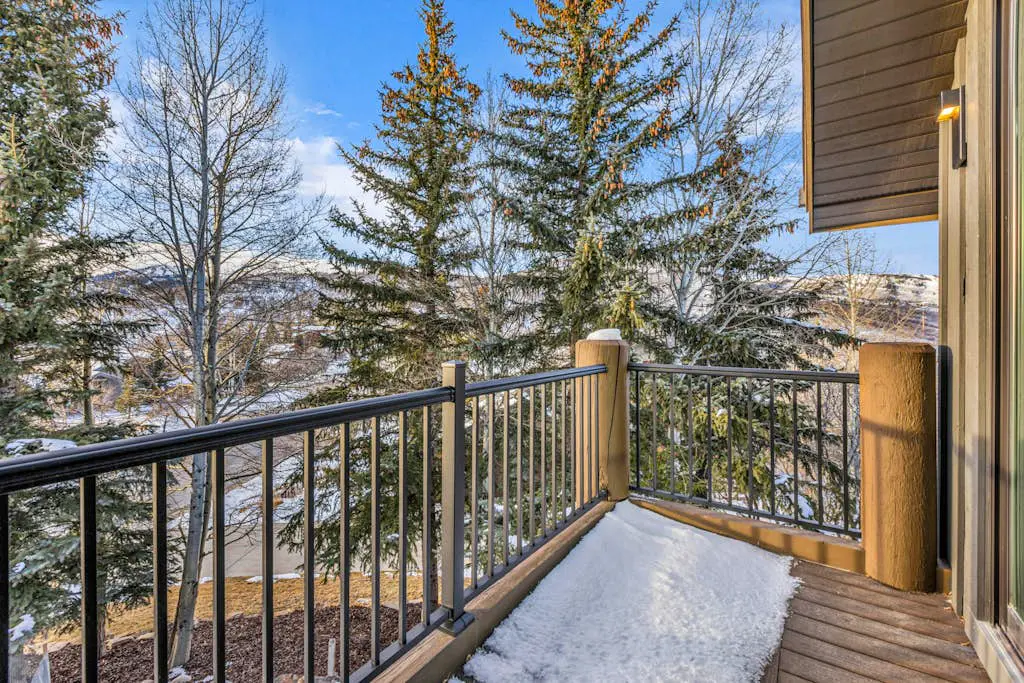 Mountain-view abode with a hot tub, scenic balcony, fireplaces, & free shuttle