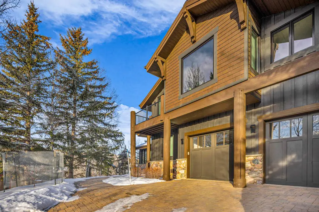 Mountain-view abode with a hot tub, scenic balcony, fireplaces, & free shuttle