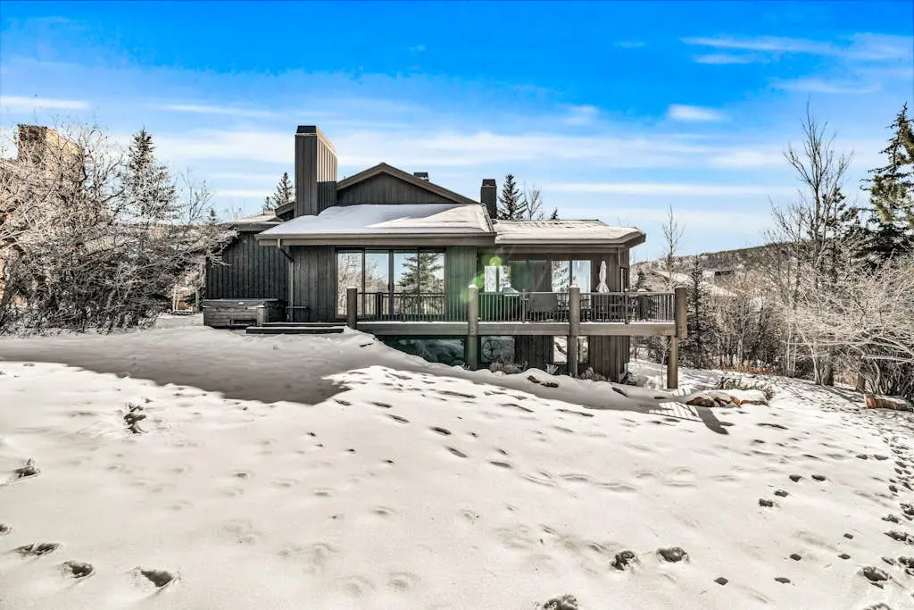 Mountain-view abode with a hot tub, scenic balcony, fireplaces, & free shuttle