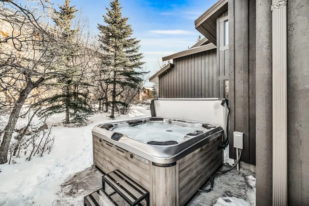 Mountain-view abode with a hot tub, scenic balcony, fireplaces, & free shuttle