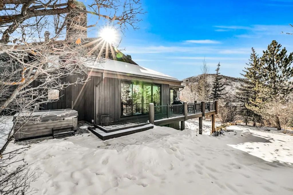Mountain-view abode with a hot tub, scenic balcony, fireplaces, & free shuttle