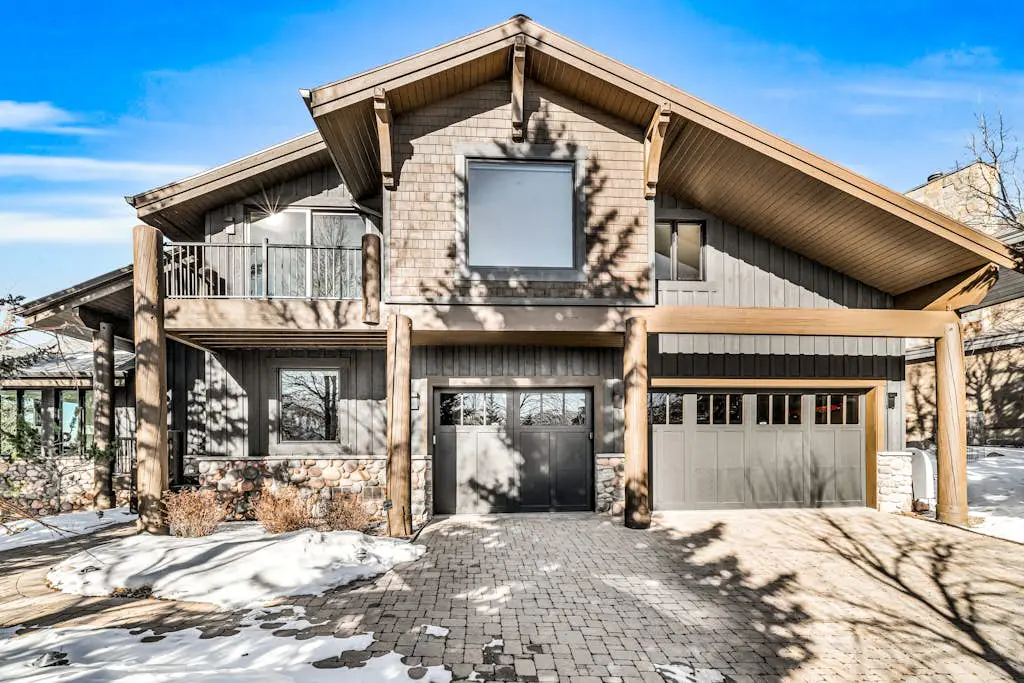 Mountain-view abode with a hot tub, scenic balcony, fireplaces, & free shuttle