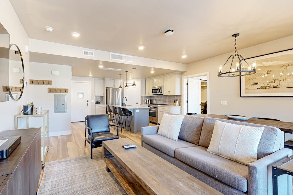 Modern resort condo with pool, hot tub, rolling foothill views + shuttle