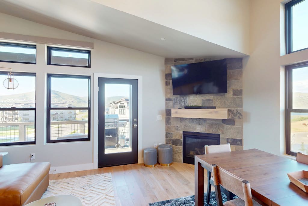 Modern condo with fireplace and private balcony - lake view