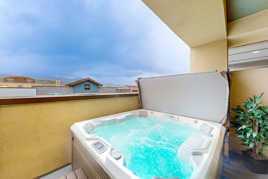 Inviting condo in Newpark Town Center with hot tub and great balcony views