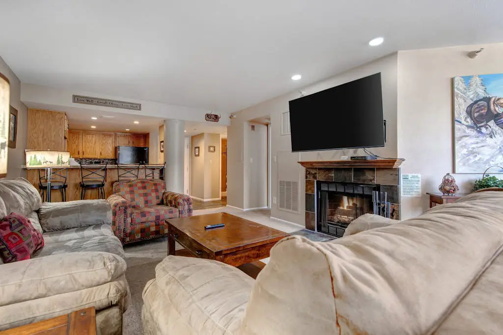 Ski-in/out condo with WiFi, private hot tub, fireplace, shared pool, & gym