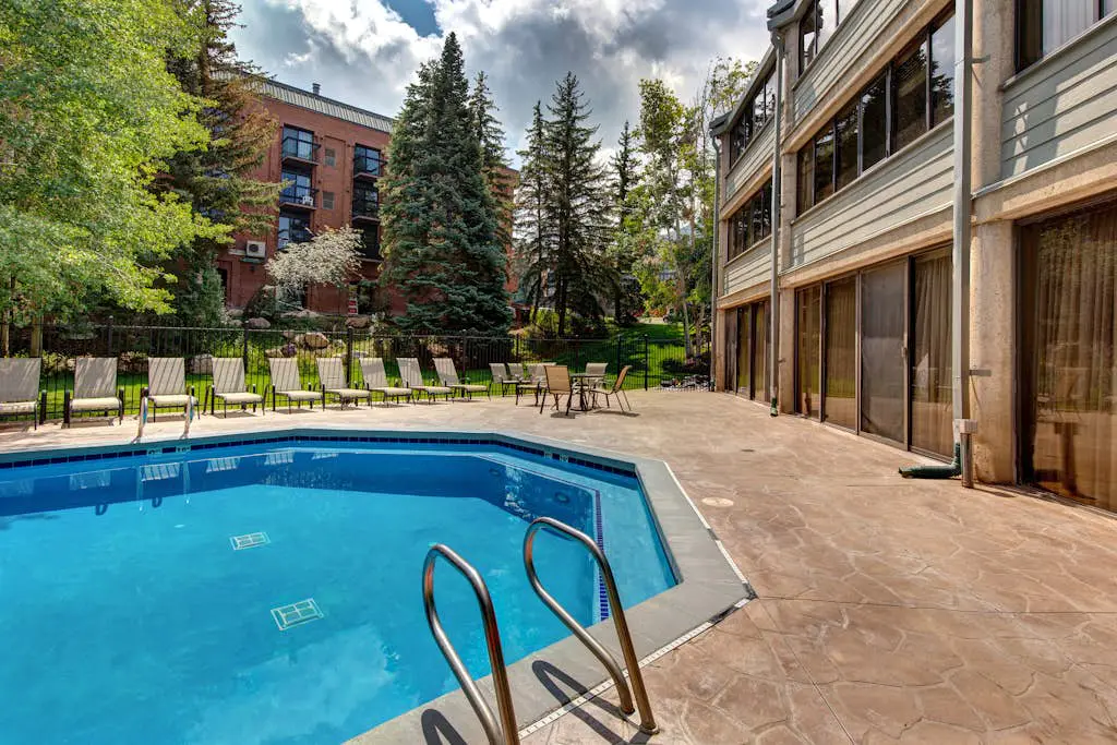 Ski-in/out condo with WiFi, private hot tub, fireplace, shared pool, & gym