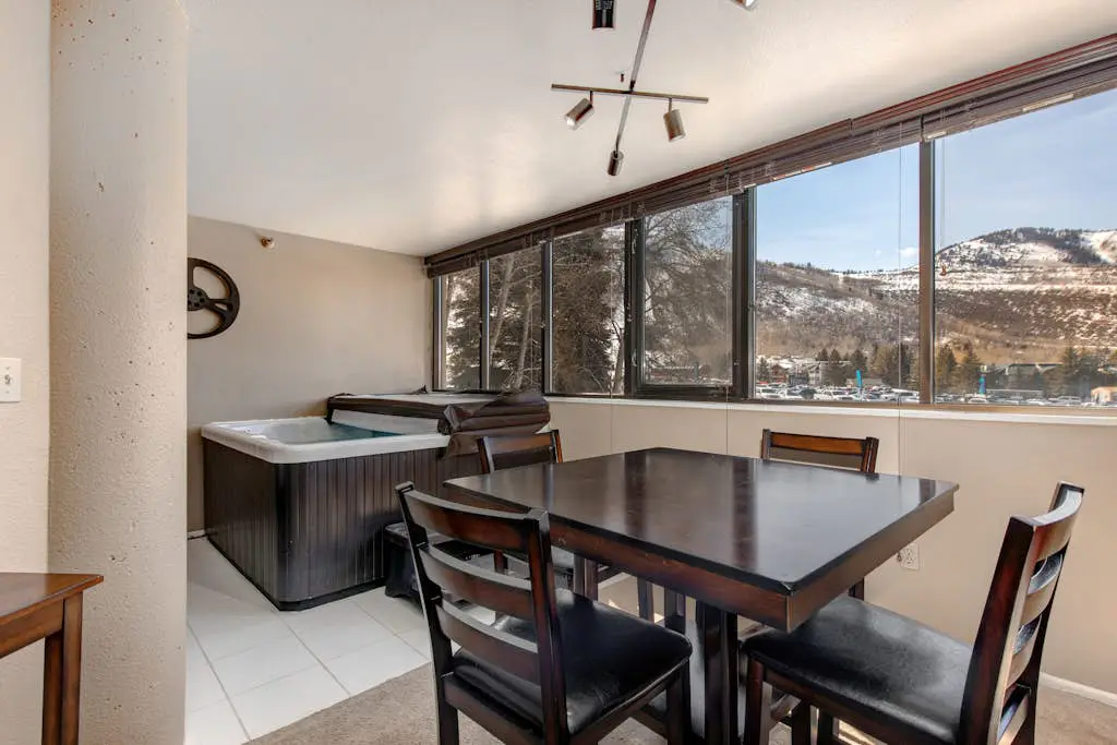 Ski-in/out condo with WiFi, private hot tub, fireplace, shared pool, & gym