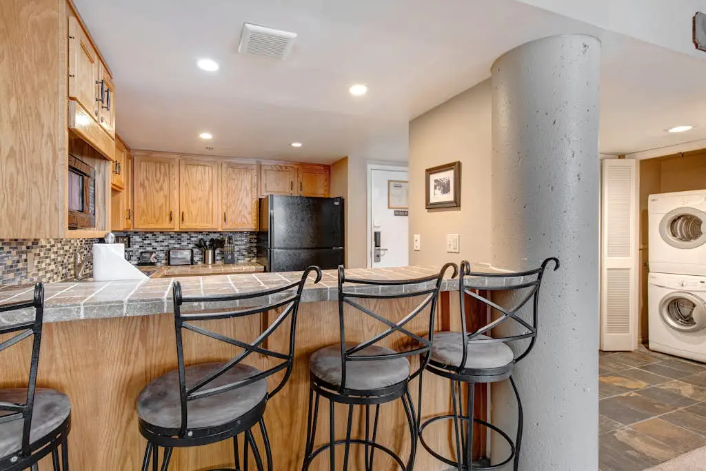 Ski-in/out condo with WiFi, private hot tub, fireplace, shared pool, & gym