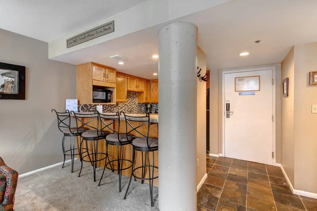 Ski-in/out condo with WiFi, private hot tub, fireplace, shared pool, & gym