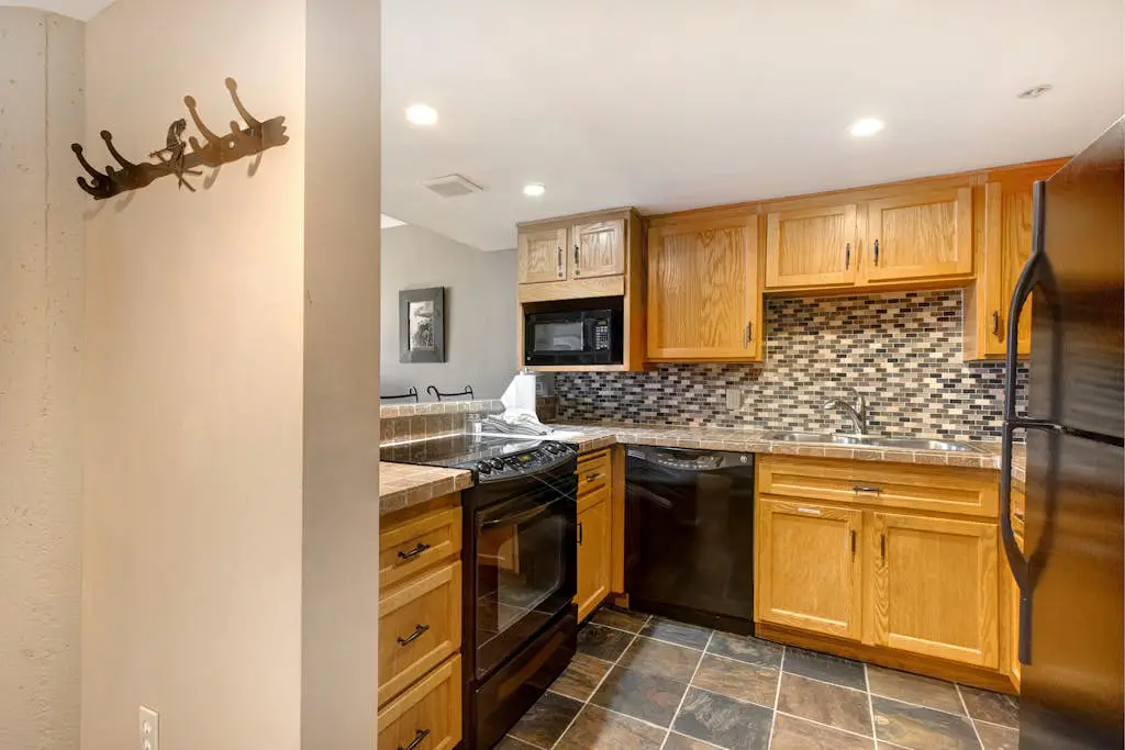 Ski-in/out condo with WiFi, private hot tub, fireplace, shared pool, & gym