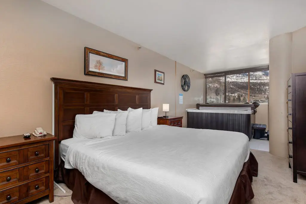 Ski-in/out condo with WiFi, private hot tub, fireplace, shared pool, & gym