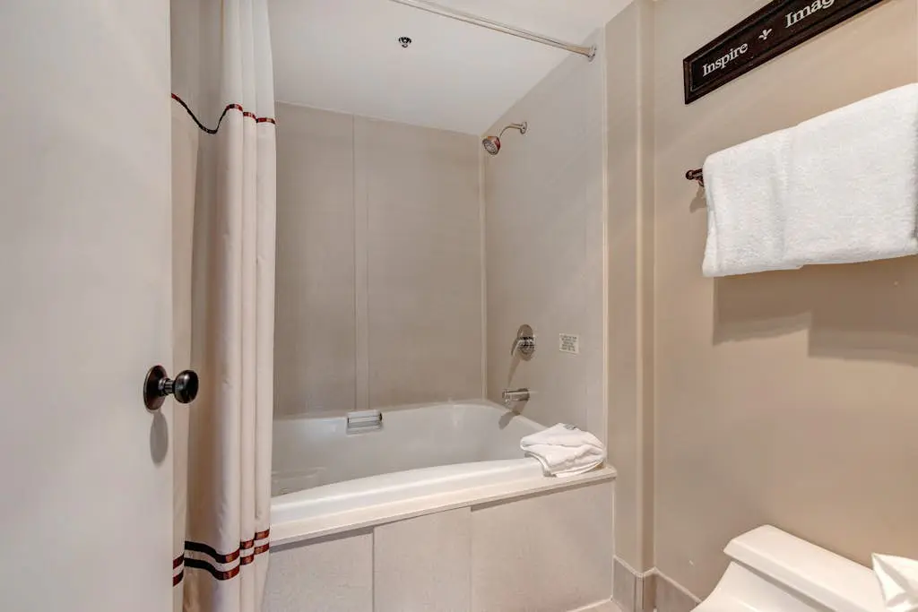 Ski-in/out condo with WiFi, private hot tub, fireplace, shared pool, & gym