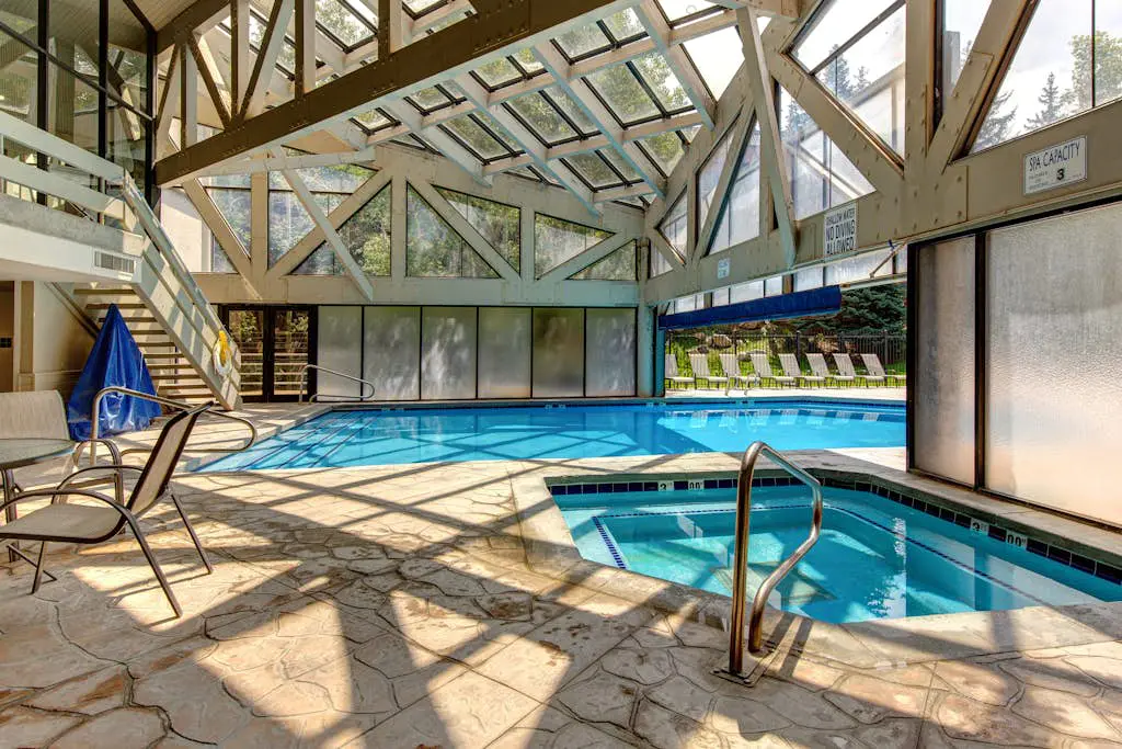 Ski-in/out condo with WiFi, private hot tub, fireplace, shared pool, & gym