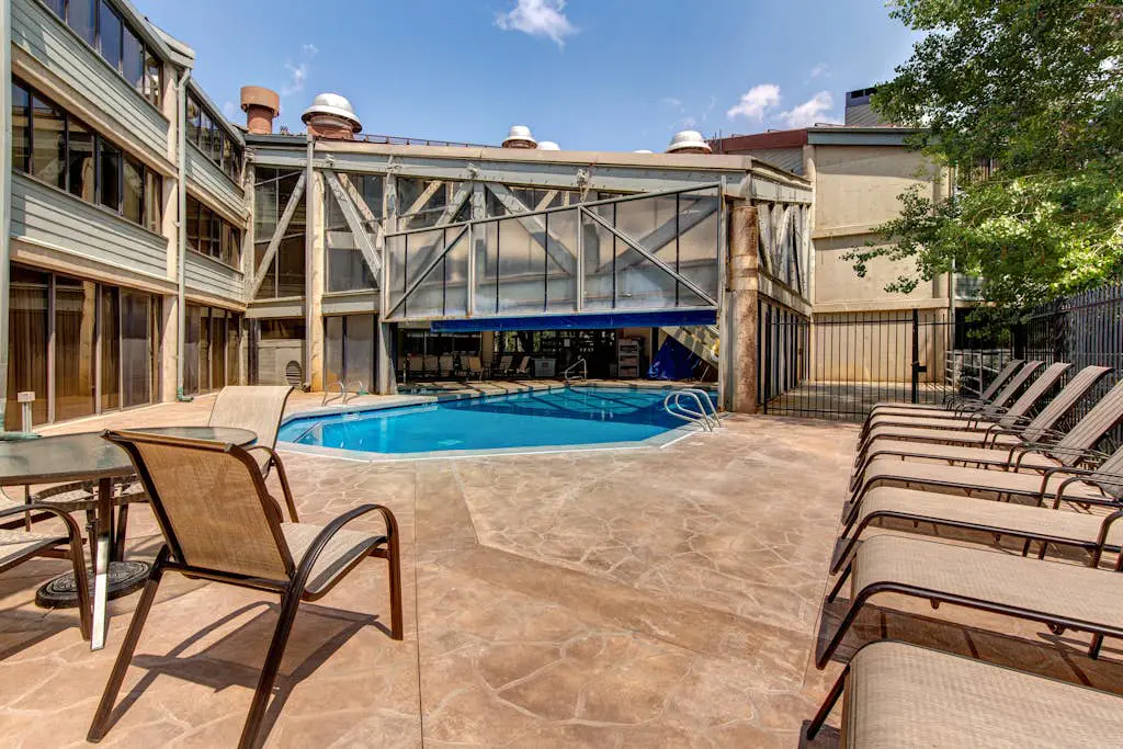 Ski-in/out condo with WiFi, private hot tub, fireplace, shared pool, & gym
