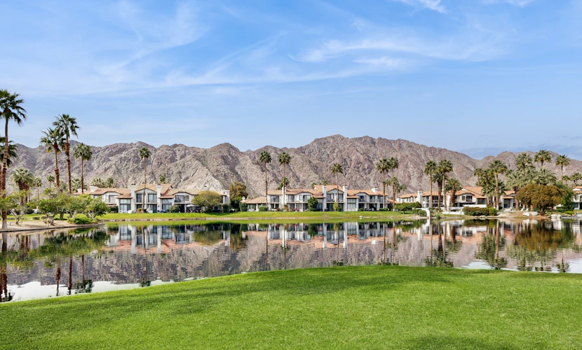 Relax in this 2BR/2.5BA home in La Quinta overlooking a peaceful pond near PGA West Golf Course.